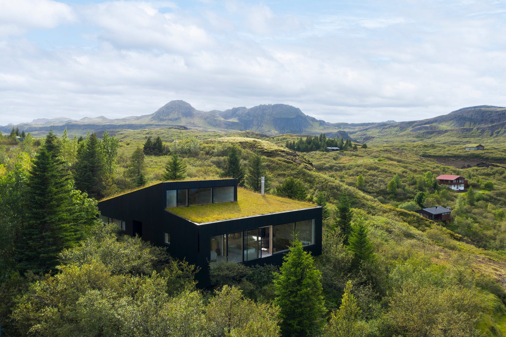 The Green-Roofed Holiday Home In Iceland Overlooking Lake And Mountain