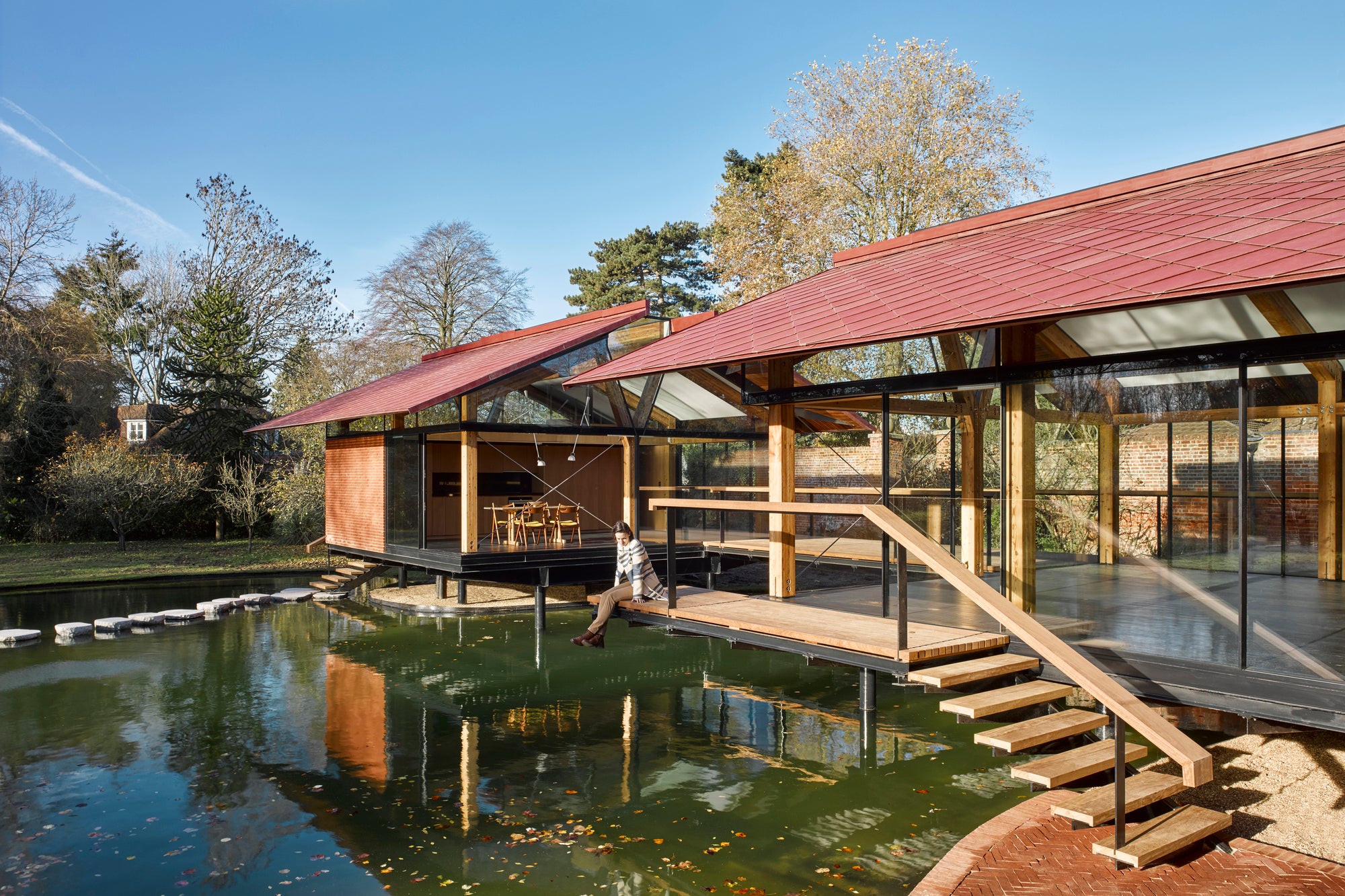 English Stepping Stones Lead Into House Extension Over A Lake