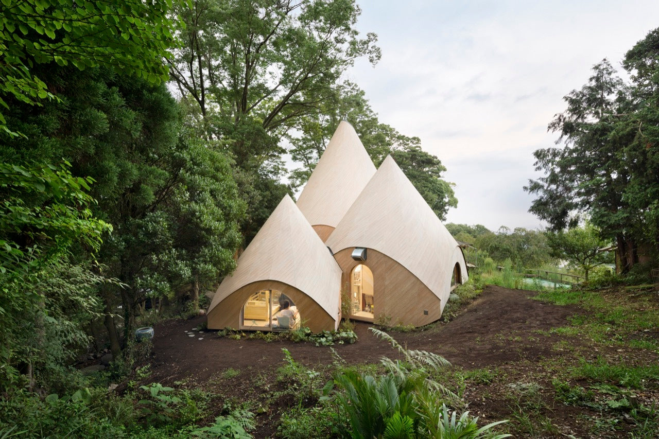 Teepee-shaped House A Community Kitchen And A Spiral-shaped Pool