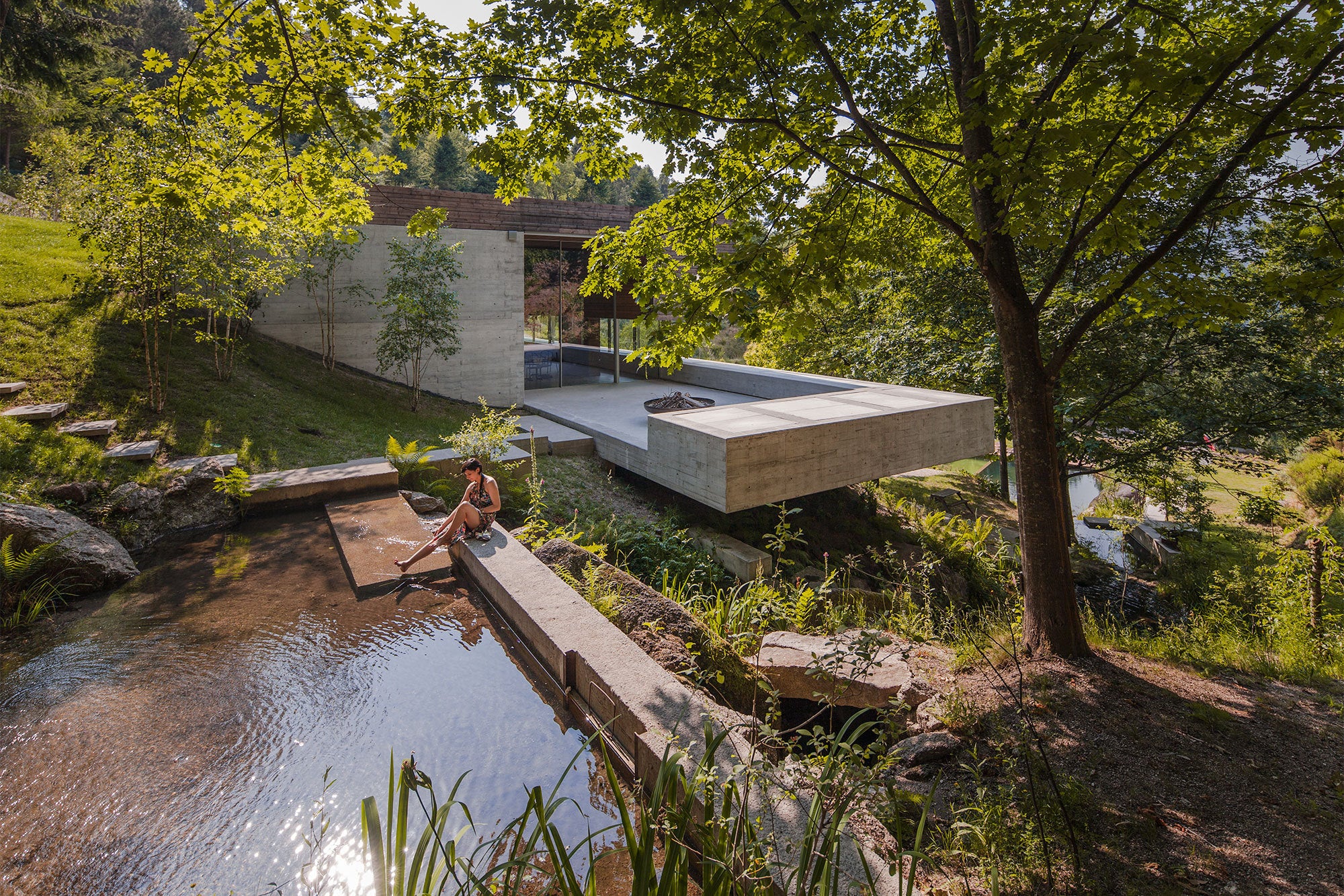 This Concrete-Wood Residence In Portugal Is Flanked By Two Ponds